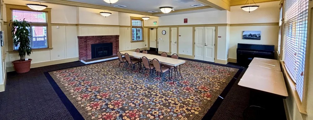 Carrillo Recreation Center Meeting Room with table and chairs set up in the center