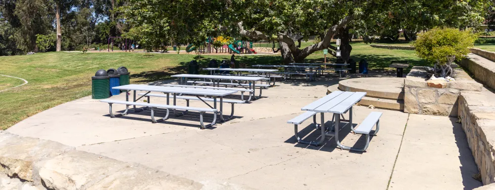 Picnic site at La Mesa Park with playground in background