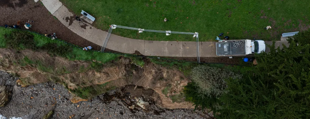 Overhead view of bluff erosion at Shoreline Park with temporary fencing in place