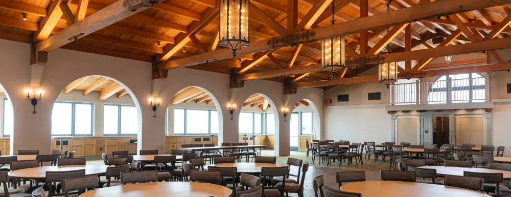 Cabrillo Pavilion Event Center set up with circle tables surrounding a central dancefloor