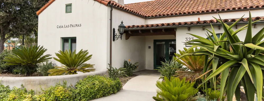 Casa Las Palmas entrance with walkway lined with plants