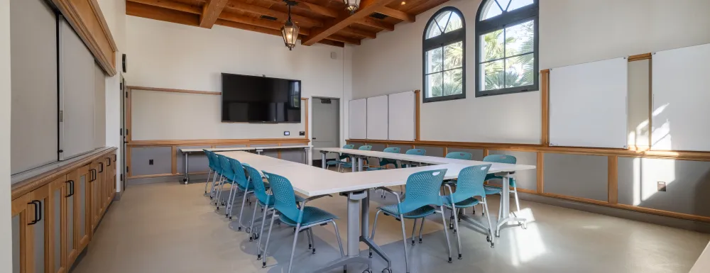 Training Room at the Cabrillo Pavilion with tables and chairs, whiteboards, and a presentation TV