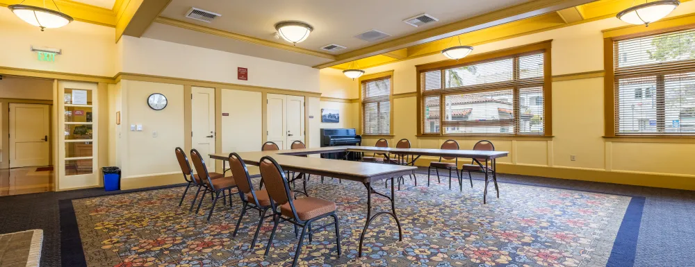 Carrillo Recreation Center Meeting Room with table and chairs set up in the center