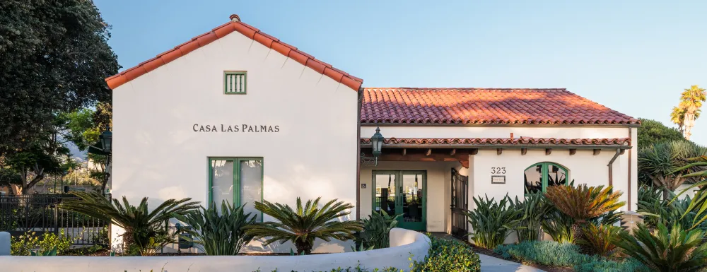 Casa Las Palmas entrance with walkway lined with plants