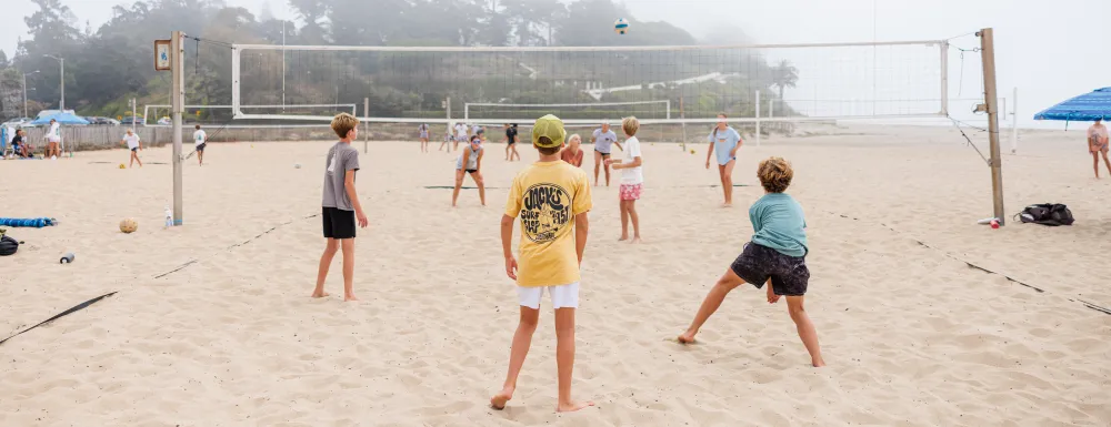 Beach Volleyball campers playing on a foggy day