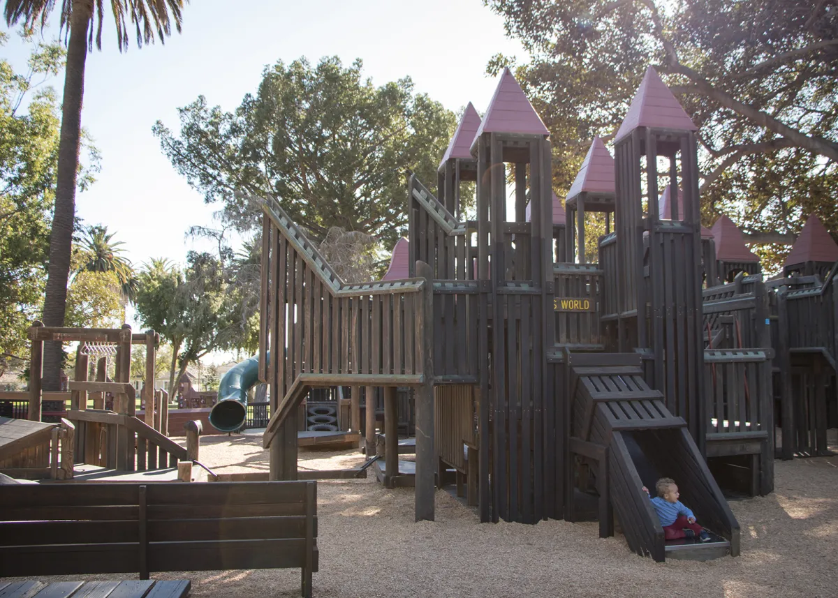 Kids' World playground with a child on slide