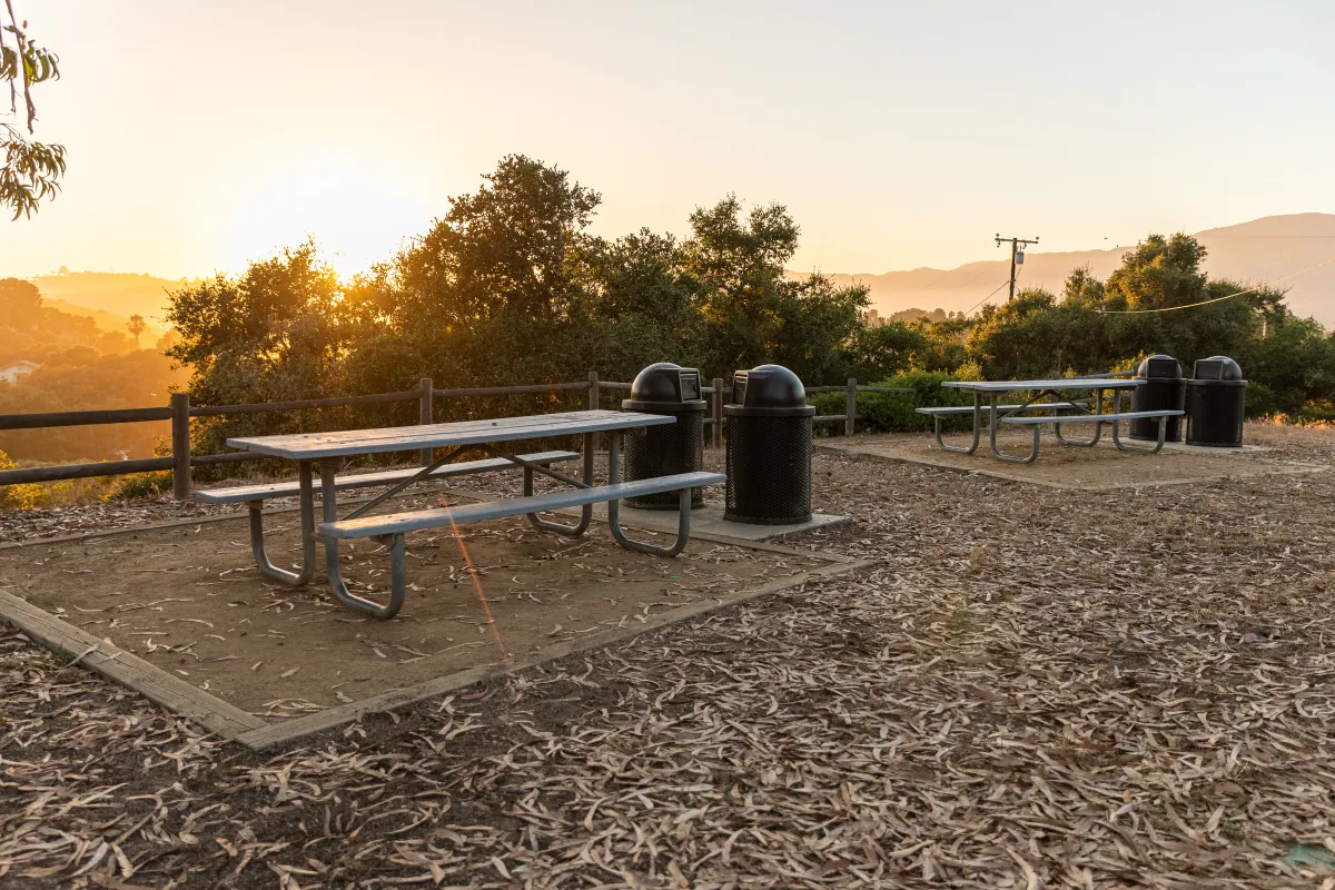 Two picnic tables at Escondido Park during a beautiful sunset
