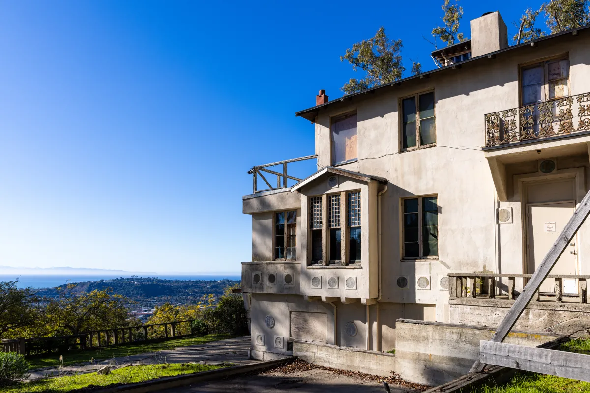 Franceschi House with view of city and ocean in the background