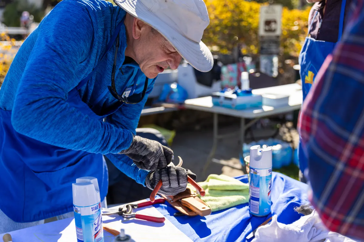 Volunteers sharpen hand pruners