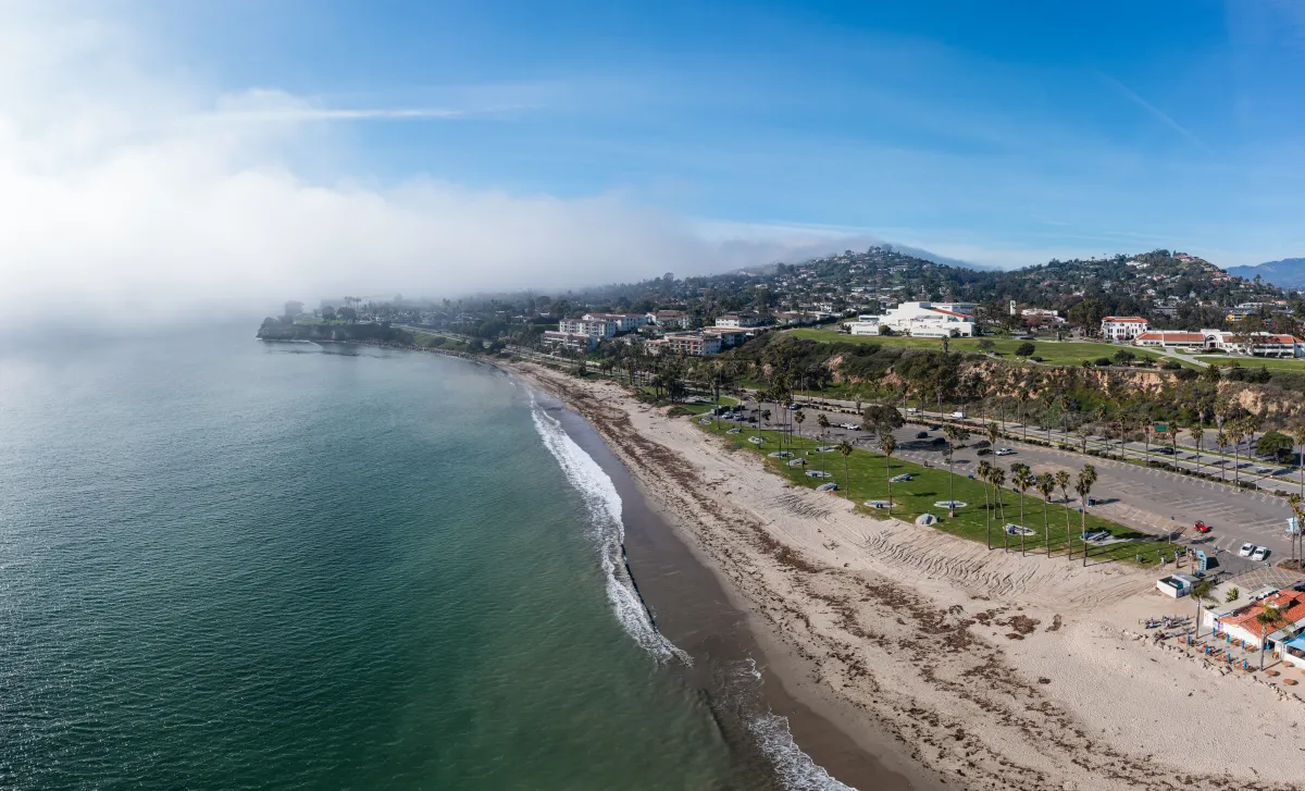 Aerial view of Leadbetter Beach, sand and grassy area.