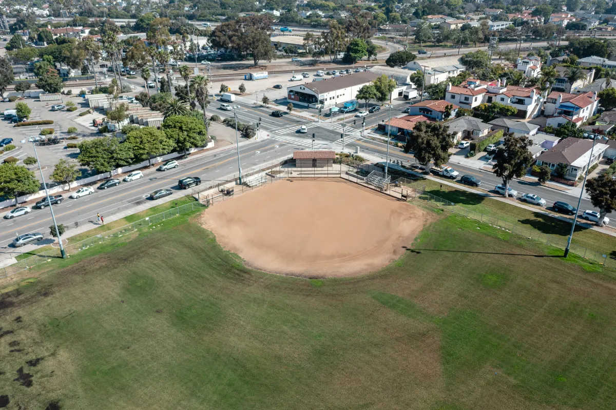 Aerial view of Cabrillo Ball Park softball field with city street in the background