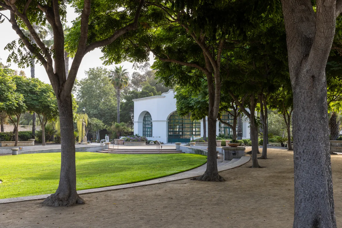 Carousel House with lawn and trees in foreground