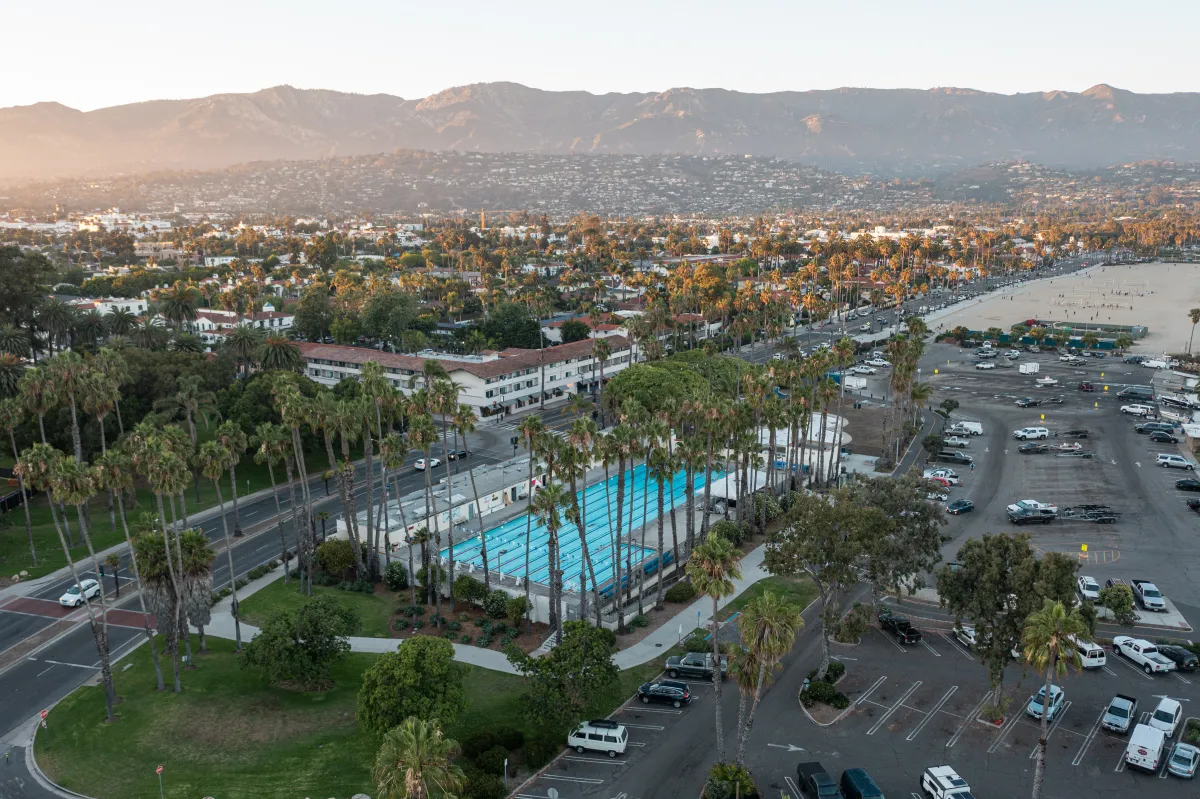 Aerial view of Los Baños pool at sunset with mountains in background