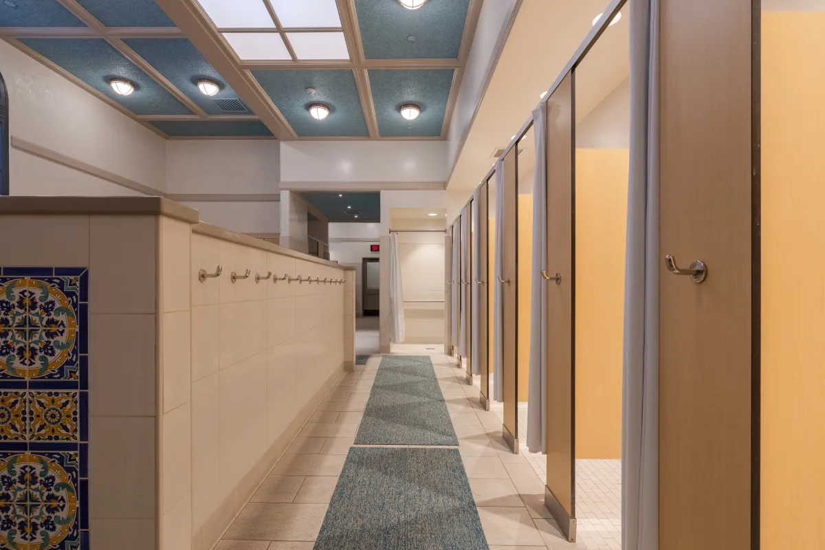 Showers and towel hooks in the Cabrillo Pavilion Locker Rooms