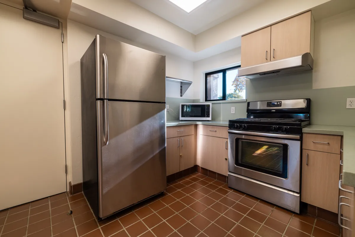 The kitchen at the Louise Lowry Davis Center featuring a refrigerator and oven