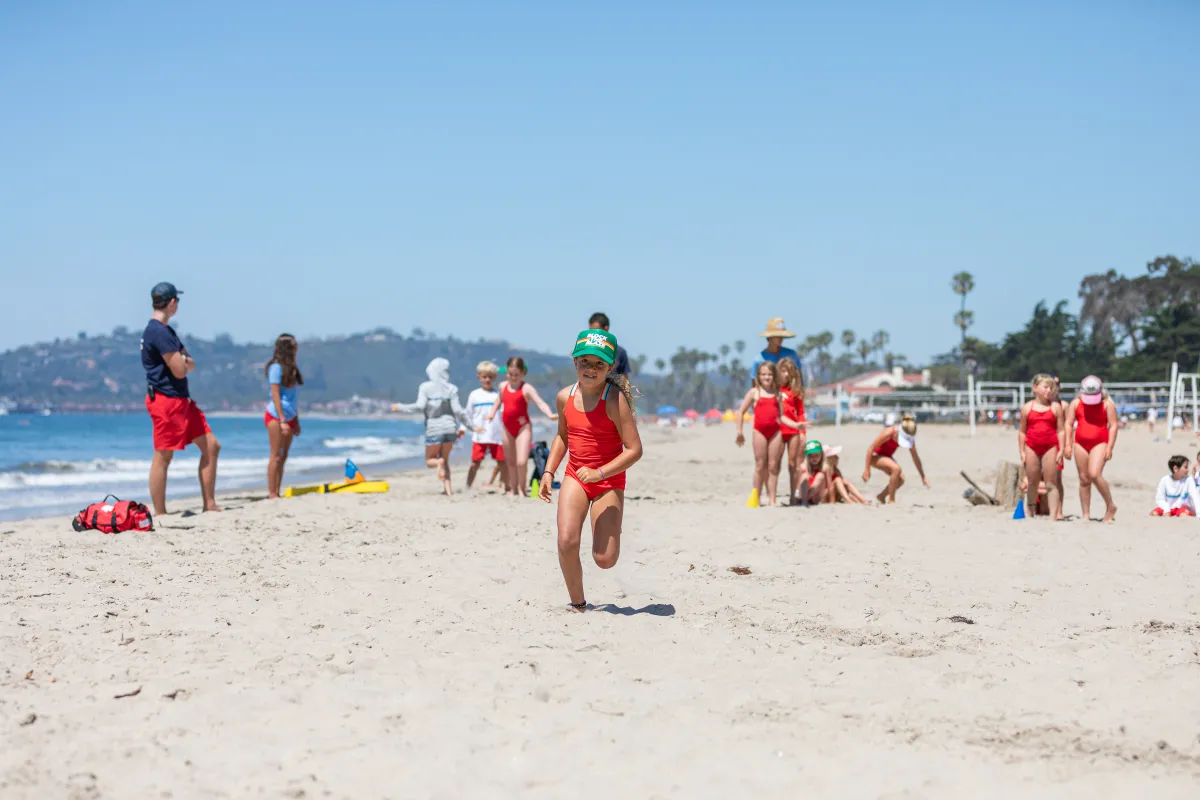 Junior Lifeguard camper running on East Beach