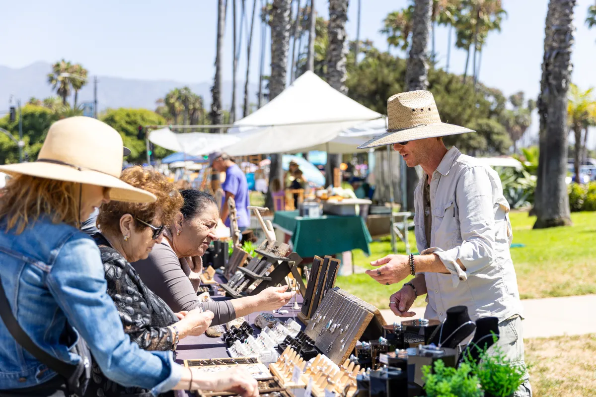 Vistiors to the Santa Barbara Arts and Crafts show browse handmade items