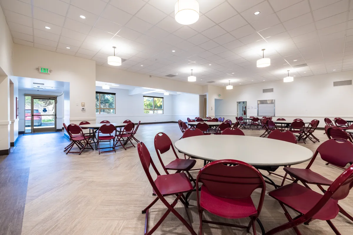 Westside Neighborhood Center main room with tables and chairs