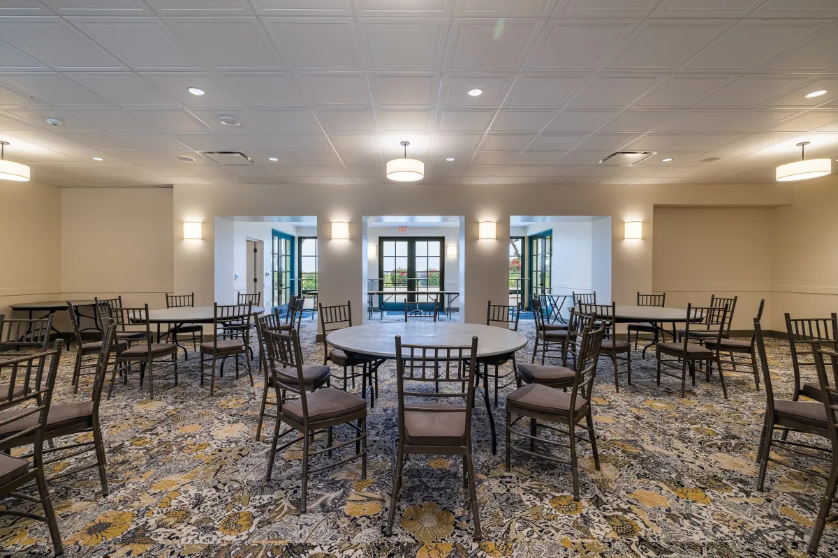 Palm Park Beach House interior with chairs and tables set up