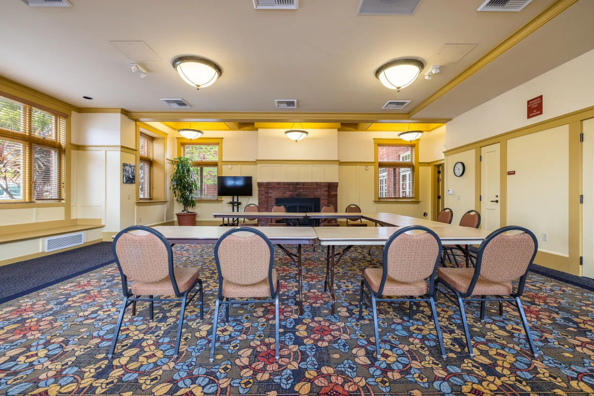 Carrillo Recreation Center Meeting Room with table and chairs set up in the center
