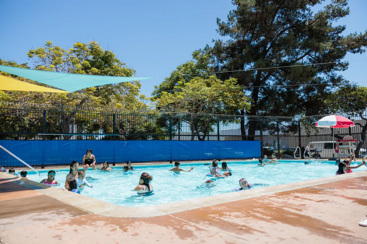 Families swim in Ortega Park Pool