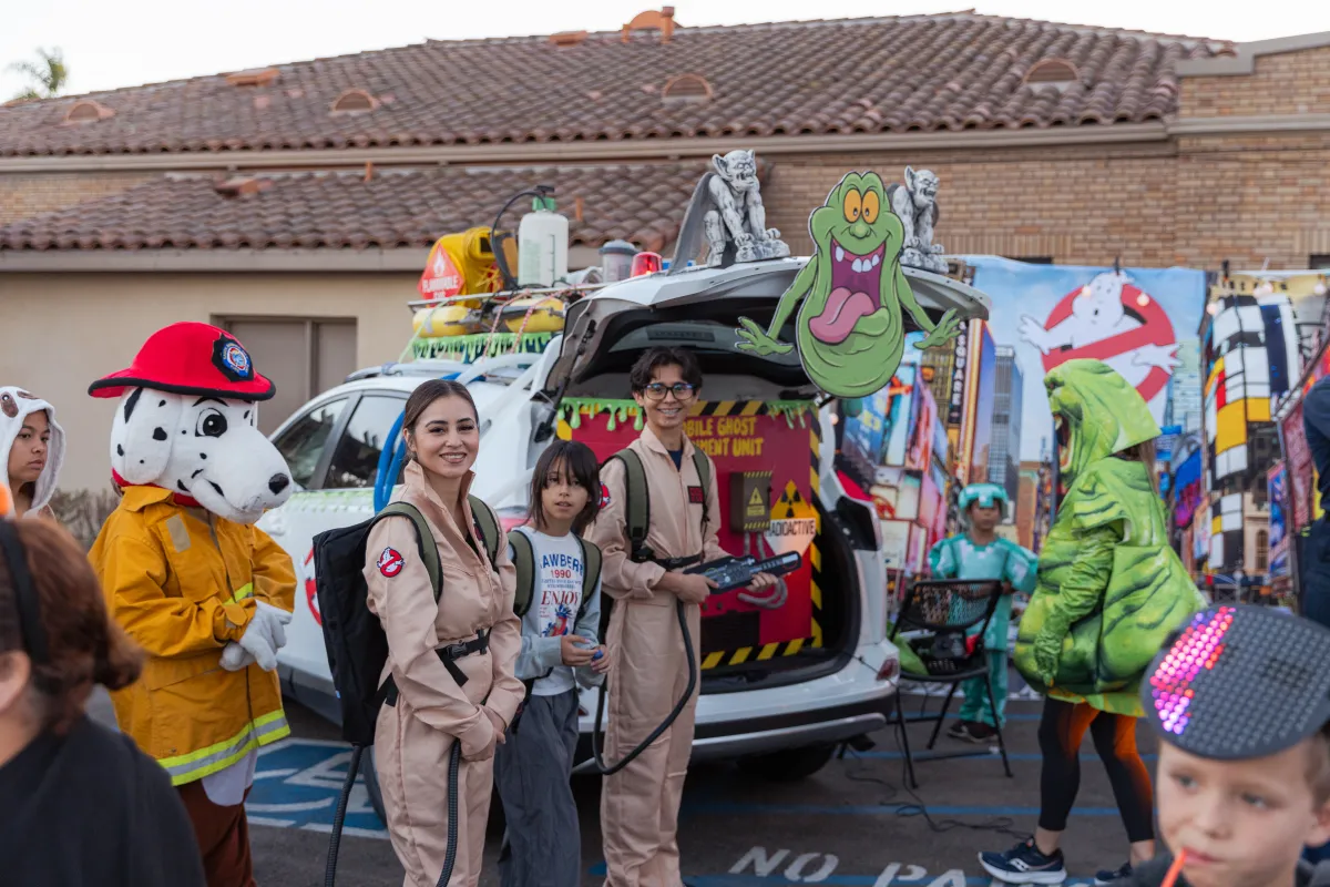 Trunk or Treat set up with staff members dressed as Ghost Busters