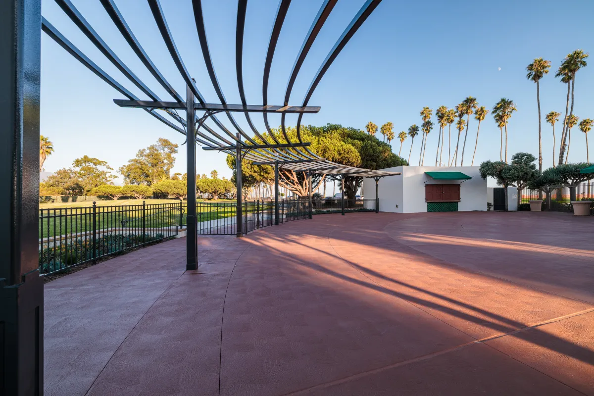 Casa Las Palmas patio with view of the Wisteria arbor and the great meadow in the background