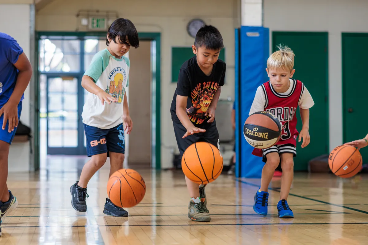 Basketball campers practicing their dribbling