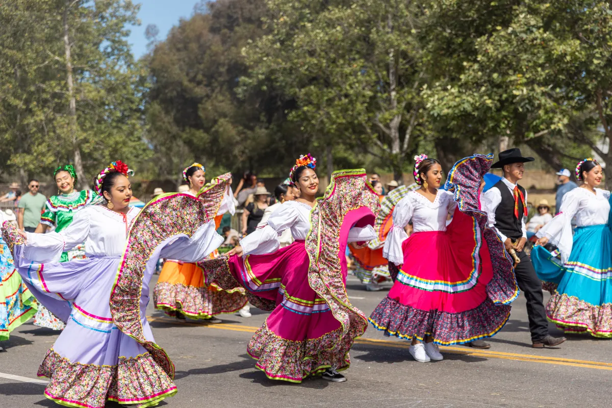 Photo from Children's Fiesta Parade, Folklórico Group in Multicolored Dresses