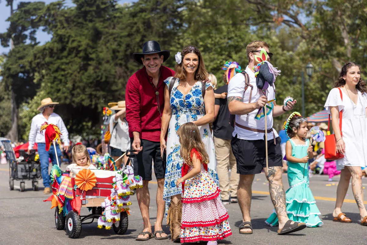 Photo from Children's Fiesta Parade, Family Dressed in Multicolored Clothing