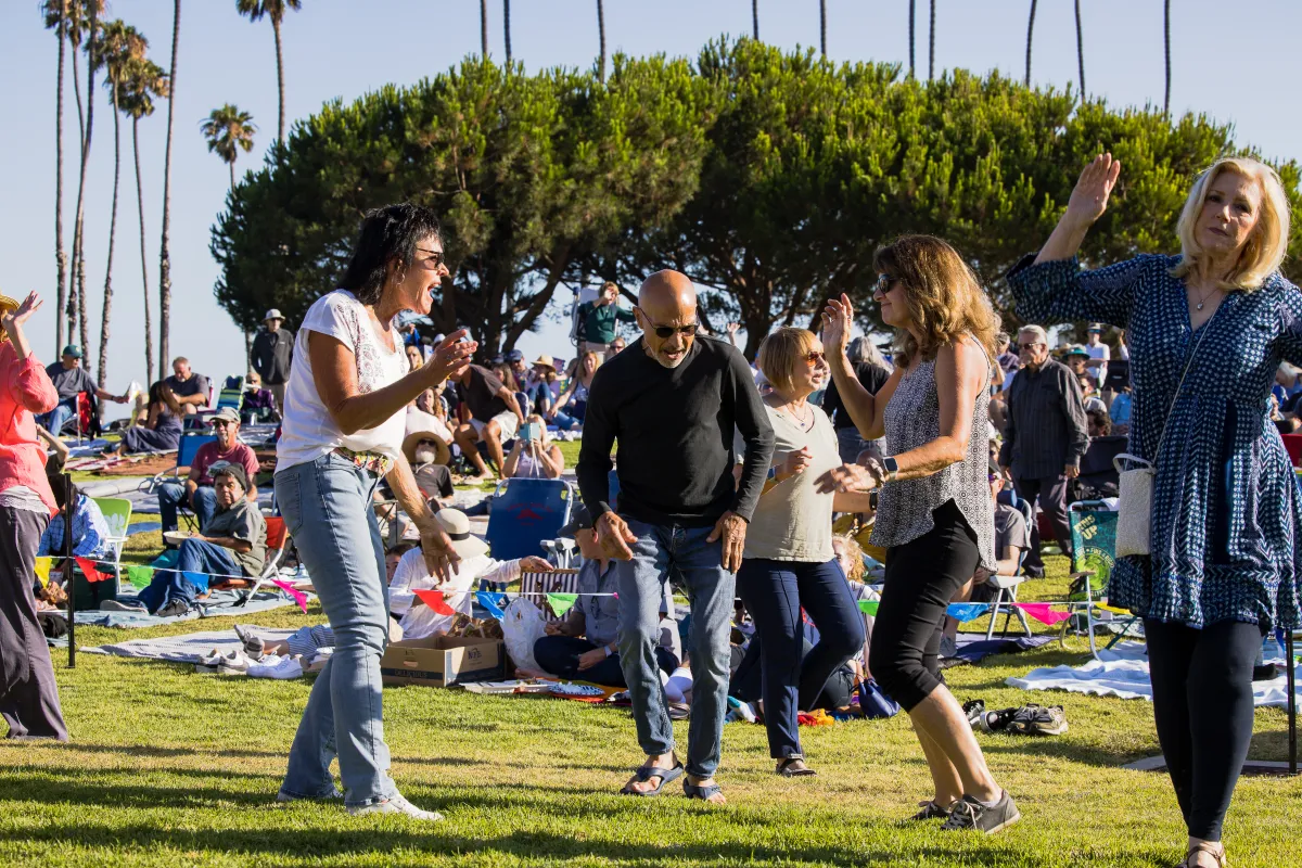 People dancing during Concerts in the Park at Chase Palm Park 