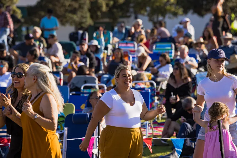 Attendees of Concerts in the Park dancing to the live music