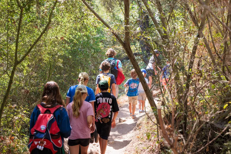 Campers go on a hike at Nature Camp