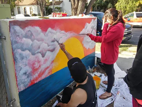 SB Arts Alliance participants paint a mural