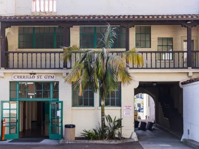 Exterior photo of the Carrillo Street Gymnasium with the front doors propped open